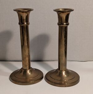Pair Of Small Brass Candlesticks With Round Bases.
